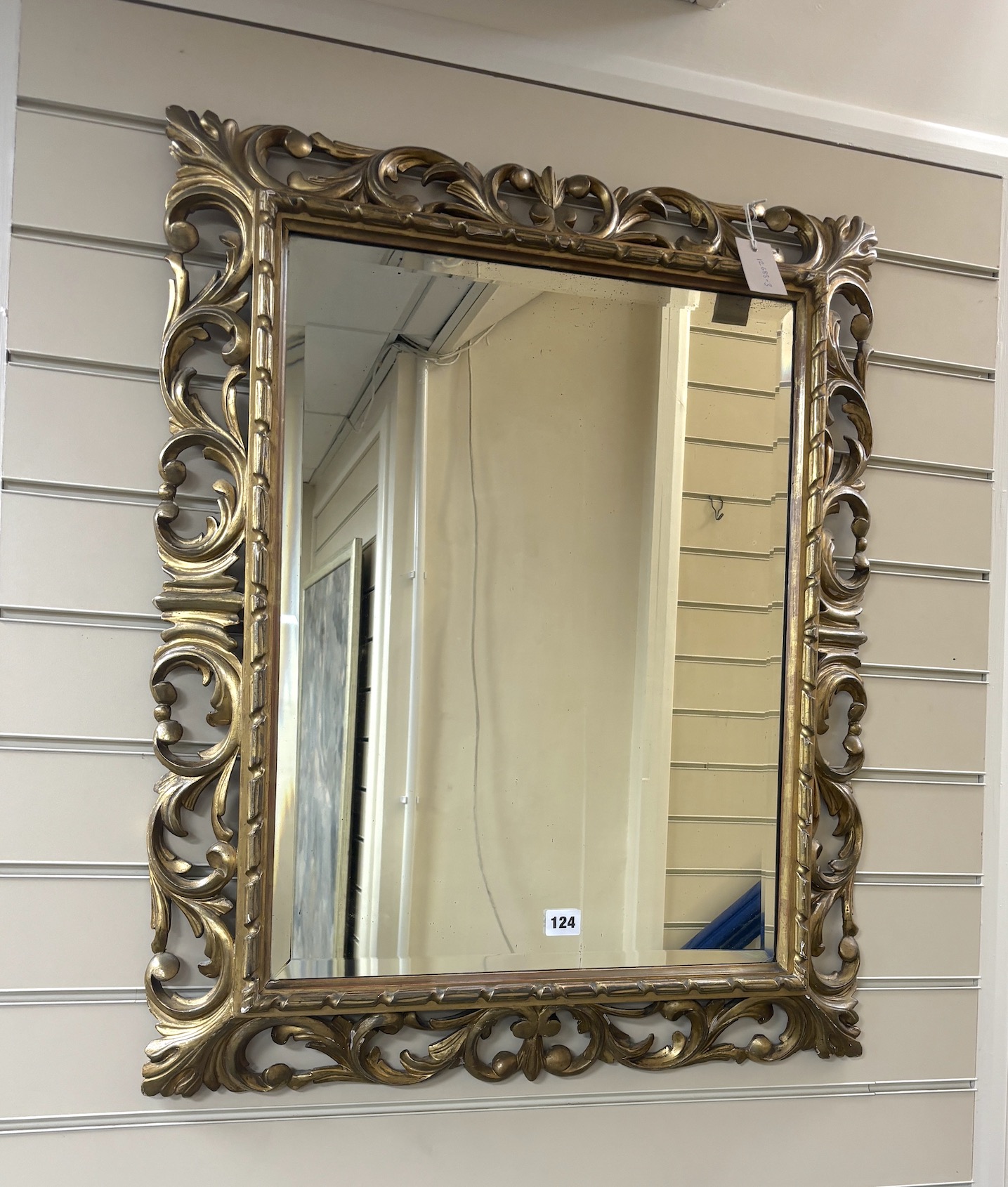 A Florentine style rectangular giltwood bevelled mirror, width 65cm, height 80cm